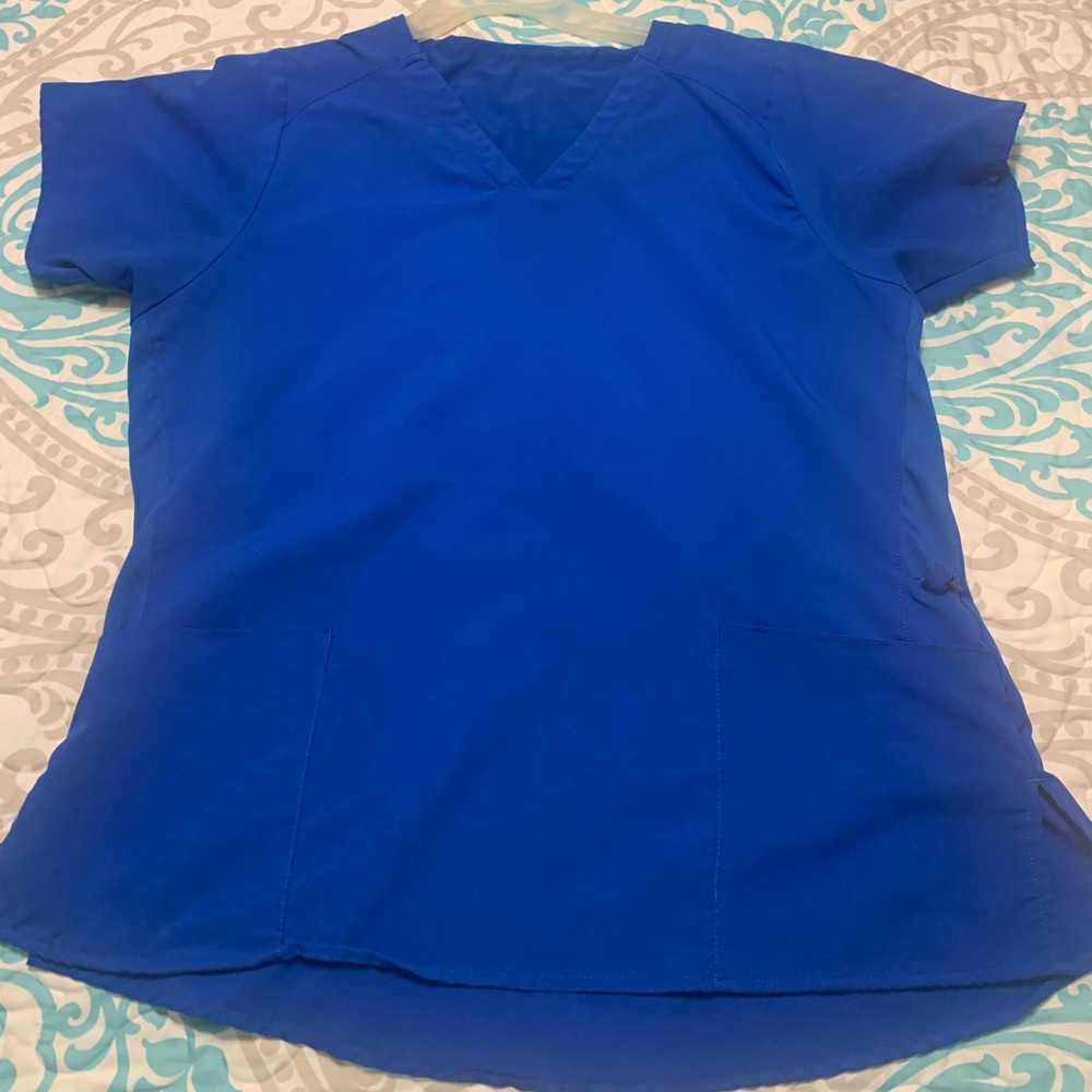Set of royal blue scrubs. Good condition. No stains or tears.